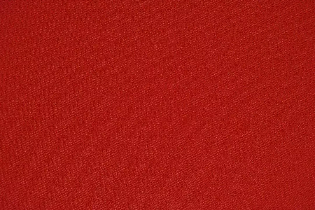 A close up image of a red fabric.