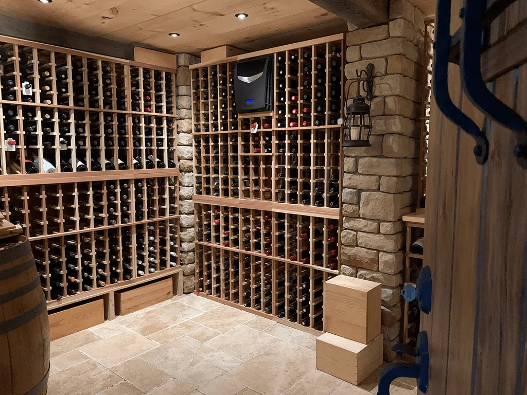 A wine cellar with wooden shelves and barrels featuring the unique ambiance of Auto Draft.