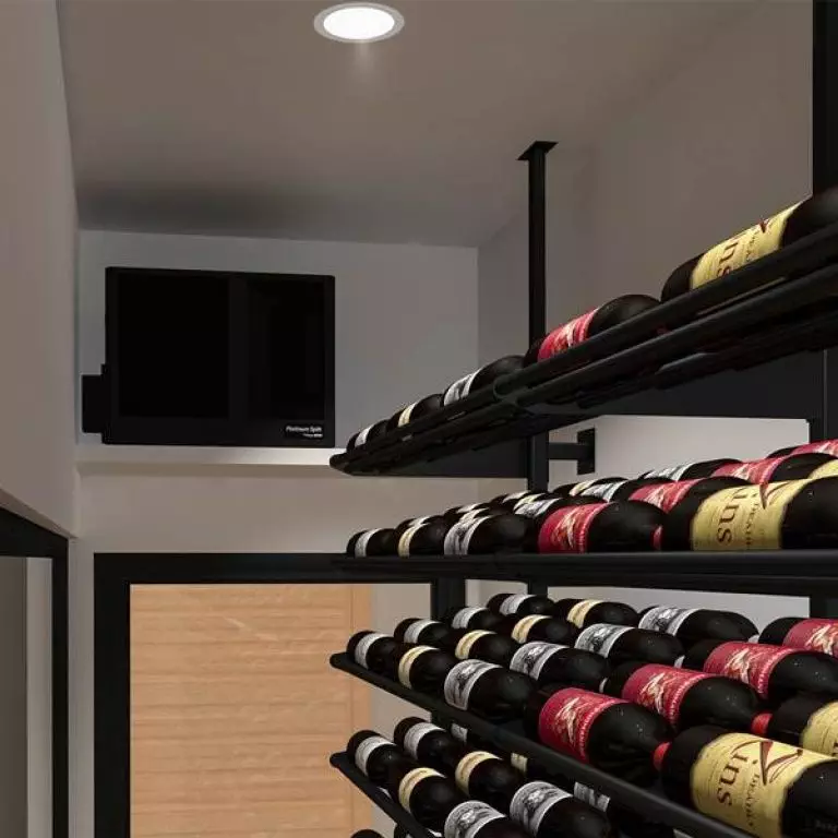 Wine storage room with bottles organized on horizontal racks, a ventilation unit installed near the ceiling, and soft lighting.